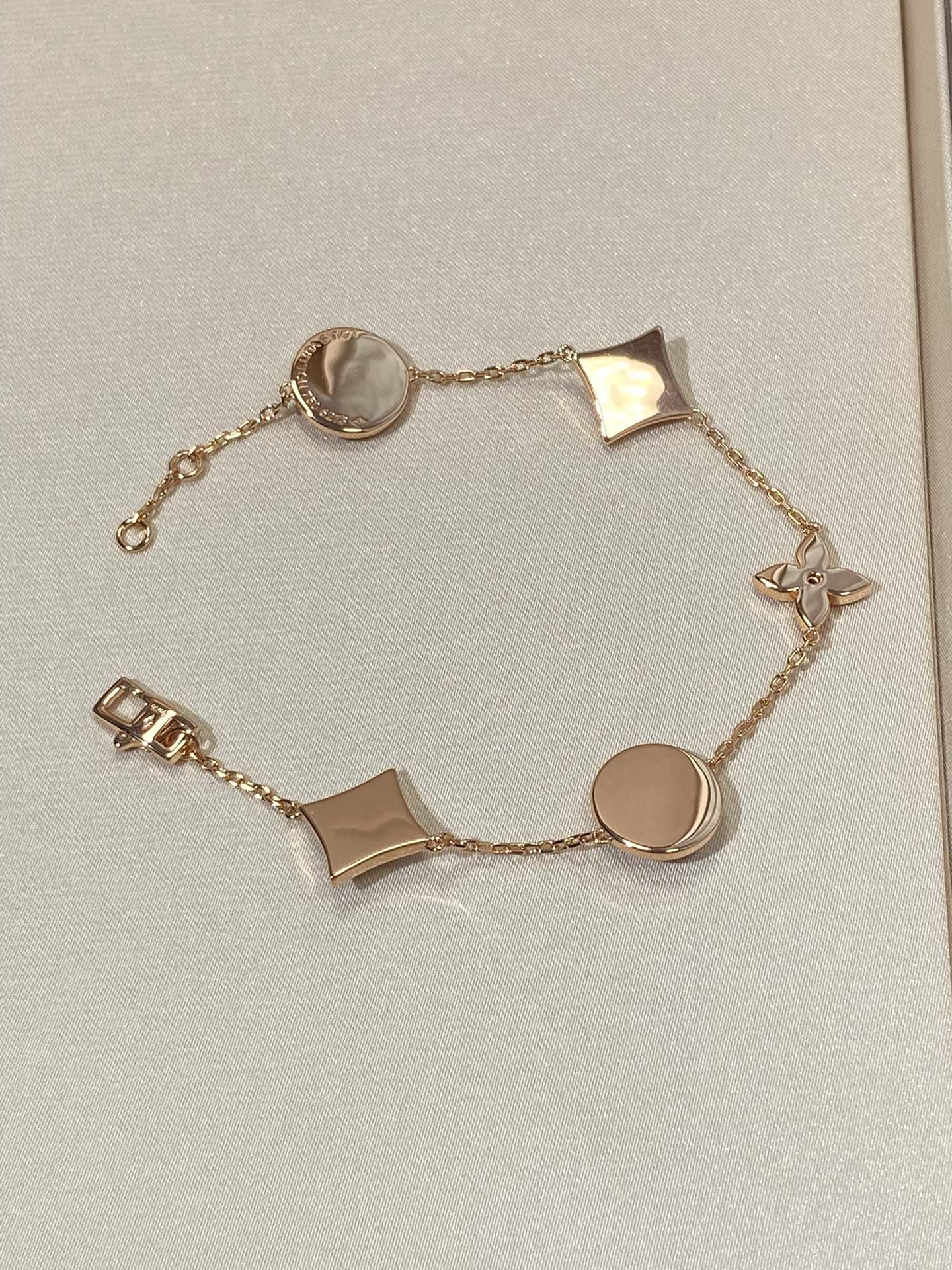[Star Jewelry]STAR AND SUN 5 MOTIF MOP PINK GOLD BRACELET