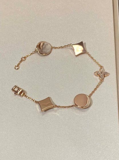 [Star Jewelry]STAR AND SUN 5 MOTIF MOP PINK GOLD BRACELET