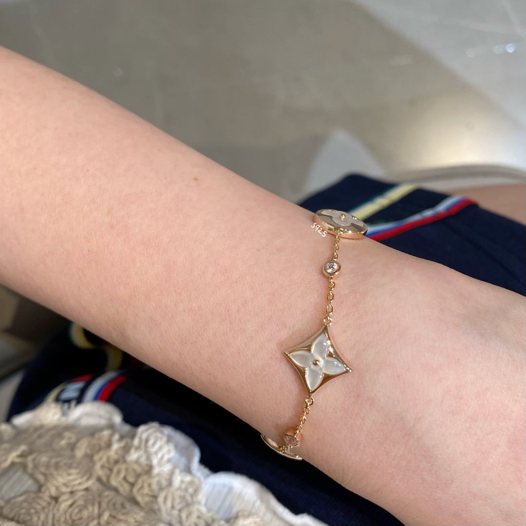 [Star Jewelry]STAR AND SUN 4 MOTIF WHITE MOP PINK GOLD BRACELET